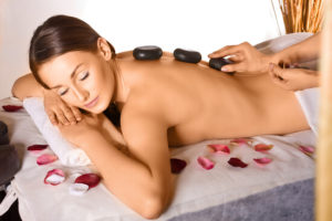 heated stones on massage therapy