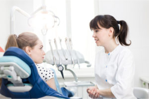 dentist and patient in clinic