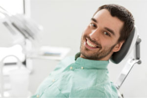 The man is conscious during dental treatment.